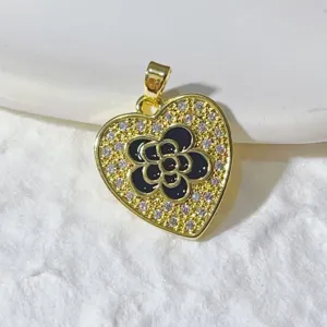 Gold-plated micro-paved zirconia heart pendant with black flower charm for DIY necklace jewelry making.