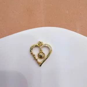 Gold-plated heart volleyball pendant detail, micro-inlaid zircon, exquisite jewelry accessory.