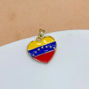 Detailed close-up view of Venezuela flag heart pendant, gold plated enamel jewelry charm.