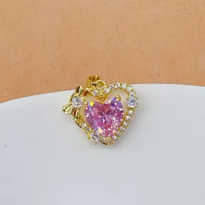 Gold heart pendant detail view, pink zircon and micro-pave stones diy jewelry accessory.