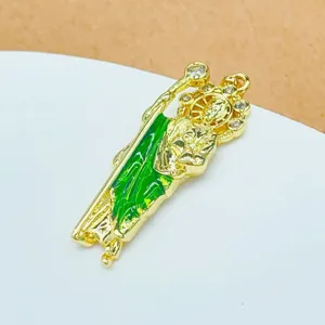 Gold plated religious pendant detail, micro paved cubic zirconia with green enamel, perfect.