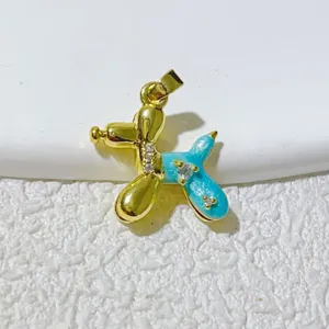 Blue enamel balloon dog pendant detail, gold tone metal charm for DIY necklace bracelet.