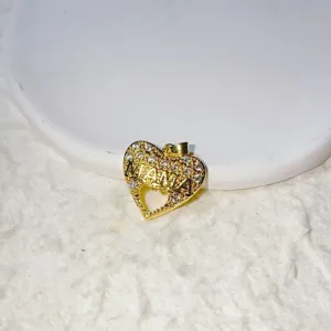 Detailed close-up shot of the gold-plated heart pendant featuring micro-inlaid cubic zirconia.