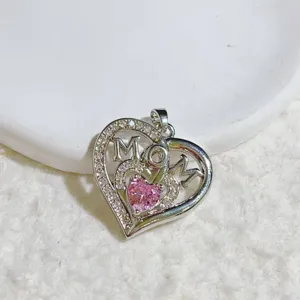 Detailed view of the elegant silver-tone MOM heart pendant necklace with clear sparkling crystals.