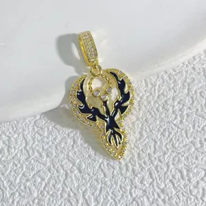 Gold plated phoenix angel wing pendant detail with black enamel and sparkling cubic zirconia.