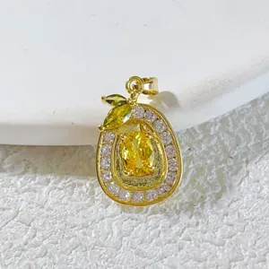 Detailed shot of a stylish gold-plated fruit pendant with yellow crystal and sparkling zirconia.