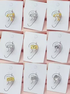 Close-up details showcasing stylish copper gold-plated ear cuffs with diverse geometric designs.