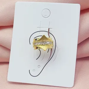 Gold crystal ear cuff detail, geometric textured ear clip, minimalist fashion jewelry accessory.