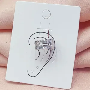 Exquisite double-row baguette crystal ear cuff detail, sparkling silver-tone design for chic style.