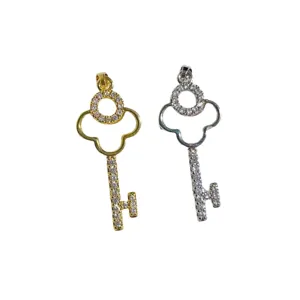Gold and silver tone key pendants inlaid with sparkling cubic zirconia, elegant DIY jewelry.