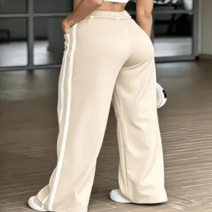 Wide leg track pants for women featuring casual side stripes and comfortable high elastic waist.