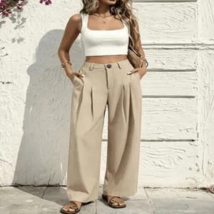 Detailed view of high-waisted pleated wide-leg pants in casual khaki style, outdoor scene.