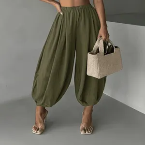 Detail view of women's lightweight olive green high waist balloon pants with comfy elastic cuff.