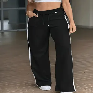 Plus size wide leg sweatpants for women, comfortable drawstring waist with side white stripes.