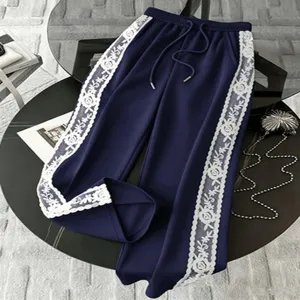 Plus size casual pants detail showing white lace side stripes and adjustable drawstring waist.