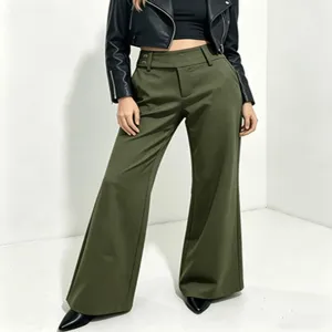 Close-up view showing the high waist design, draping fabric, and wide-leg cut of the trousers.