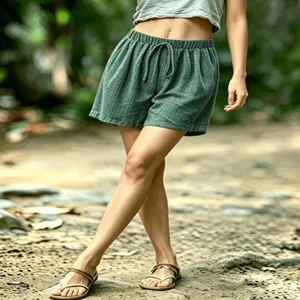 Detailed view of women's summer waffle knit drawstring casual beach shorts in green.