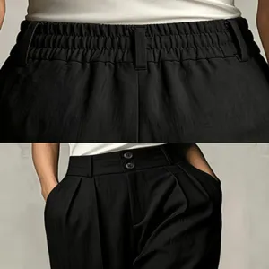 Detailed view of women high waist pleated trousers showing elastic back and front double buttons.