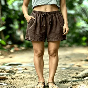 Detail view of women's waffle knit casual shorts with elastic drawstring waist and pockets.