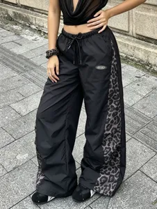 Details of Y2K fashion casual wide-leg pants with chic leopard print side panels and comfy waistband.