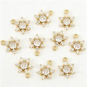Detailed view of gold snowflake zircon pendant charms for DIY jewelry making necklaces.