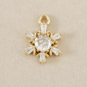 Exquisite gold snowflake pendant charm with sparkling cubic zirconia, perfect for DIY jewelry.