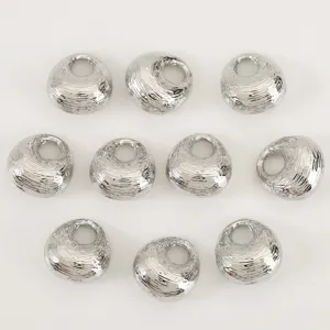 Detailed view of shiny silver irregular lucky bag shape DIY jewelry beads and charms accessories.