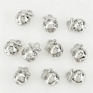 Silver tone apple metal pendants inlaid with sparkling zircons, ideal for DIY jewelry.
