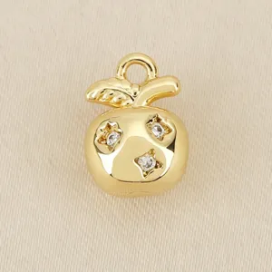 Gold plated apple pendant detail, star shaped zirconia inlay, DIY jewelry accessory close up