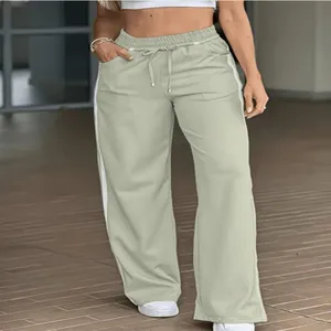 Pantaloni lunghi donna gamba larga verde chiaro coulisse elastica righe dettagli