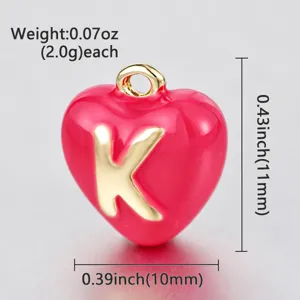 Red enamel heart letter pendant detail, golden K charm, miniature jewelry DIY accessory.