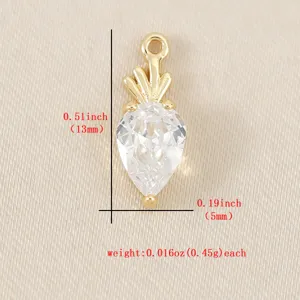 Mini gold carrot pendant with clear cubic zirconia crystal, delicate DIY jewelry charm detail.