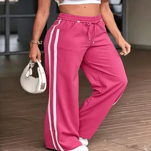 Pantaloni tuta donna casual con strisce laterali gamba larga ed elastico coulisse in vita.