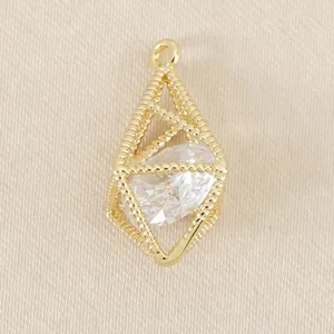 Detailed close-up shot of gold plated geometric hollow cage pendant with clear crystal inside