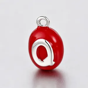 Red enamel oval letter Q charm pendant DIY jewelry accessory detail close up view