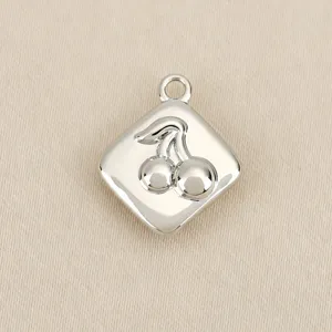 Close-up of a silver rhombus cherry charm pendant, perfect for DIY jewelry and accessories.