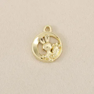 Gold plated brass hollow rabbit and carrot pendant detail shot, ideal for DIY jewelry making.