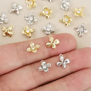 Copper plated gold zircon four-petal flower charms DIY handmade jewelry making accessories.