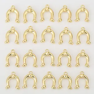 Golden horseshoe metal pendant charms close-up detail, perfect for DIY jewelry making & crafts.