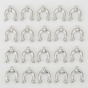 Close-up detail of silver-toned horseshoe DIY charms, smooth metallic surface for jewelry making.