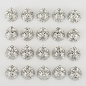 Silver tone crown metal charm detail, close-up view of shiny DIY jewelry accessories.