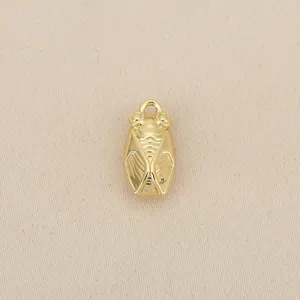 Close-up detail view of gold-plated cicada charm, exquisite texture for DIY jewelry making.