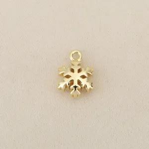 Gold plated snowflake pendant detail close up shot, perfect for DIY jewelry making accessories.