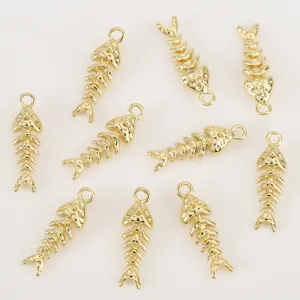 Gold fish bone pendant close-up, shiny metallic texture, perfect for custom DIY jewelry making.
