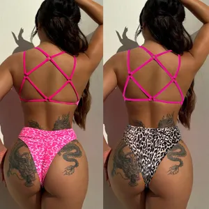 Sexy cross strap bikini swimsuit featuring high waist leopard print bottoms for women.