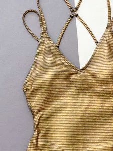 Gold metallic mesh one-piece swimsuit detail, sexy V-neck design with thin cross straps.