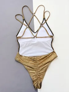 Sexy one-piece swimsuit for women with gold grid pattern and multi cross straps design.