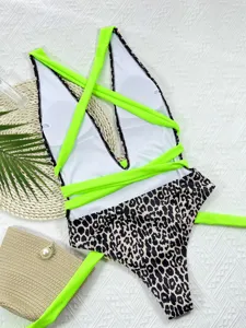 Sexy neon green strap one-piece swimsuit with leopard print bottoms for women summer beach wear.