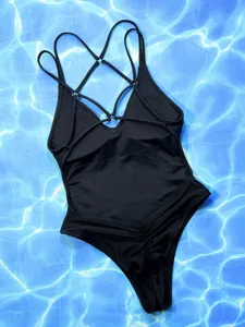 Detailed view of black one piece swimsuit featuring elegant strappy back design and comfortable fit.
