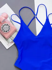 Sexy royal blue one-piece swimsuit with deep V-neck and cross strap back design for women.